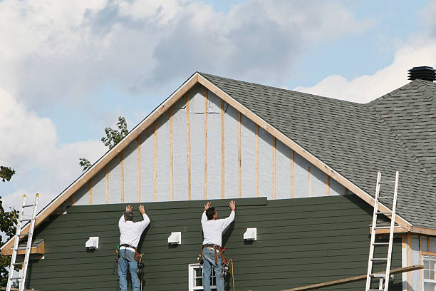 Professional Storm Damage Siding Repair technician working in Clifton, TN